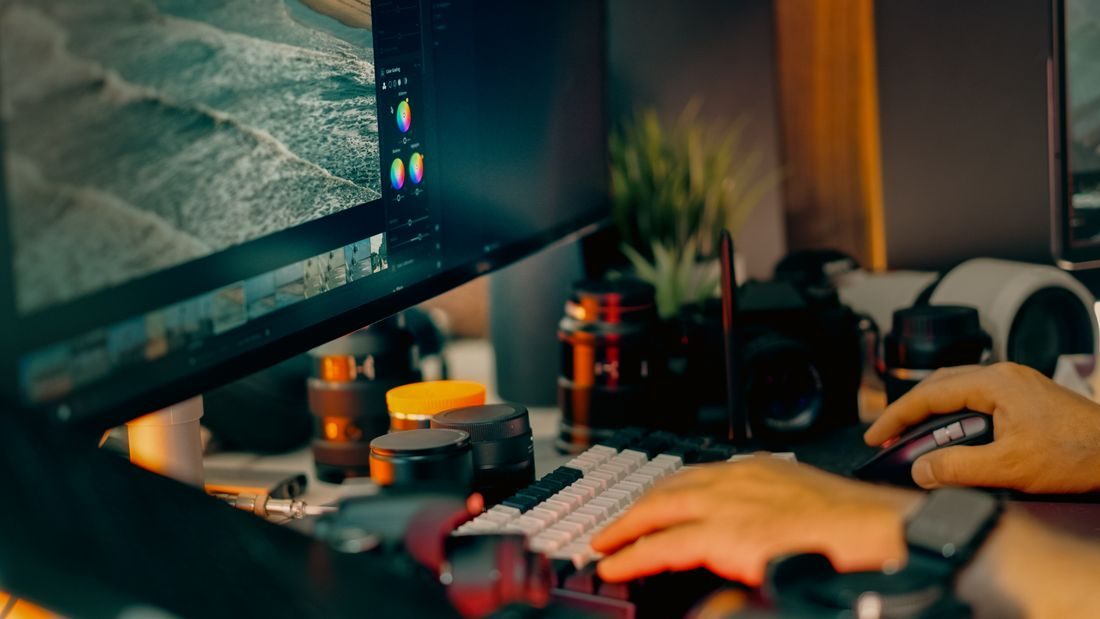 A computer workspace with a video editing screen.